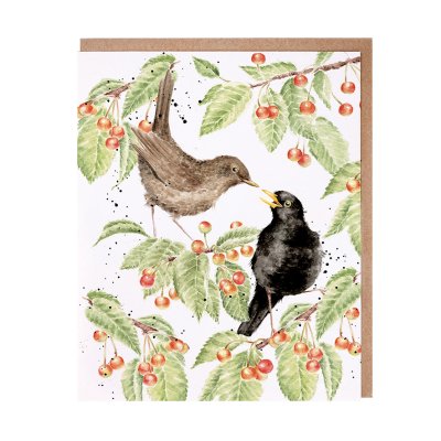 Male and female blackbirds in a cherry tree greeting card